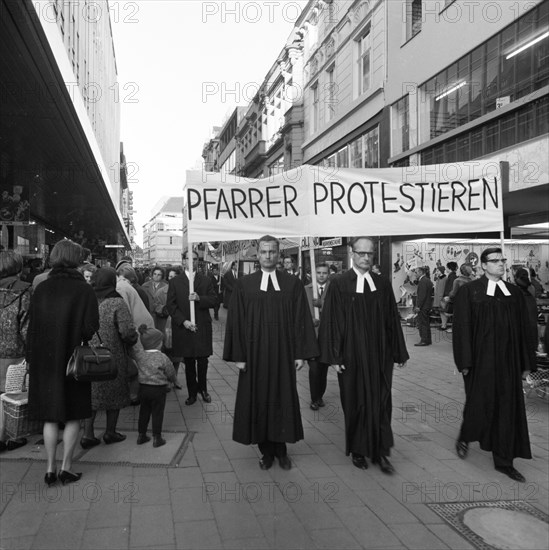 Those who support the Vietnam War betray the gospel of love. Pastors protest. With these slogans and sometimes wearing their robes