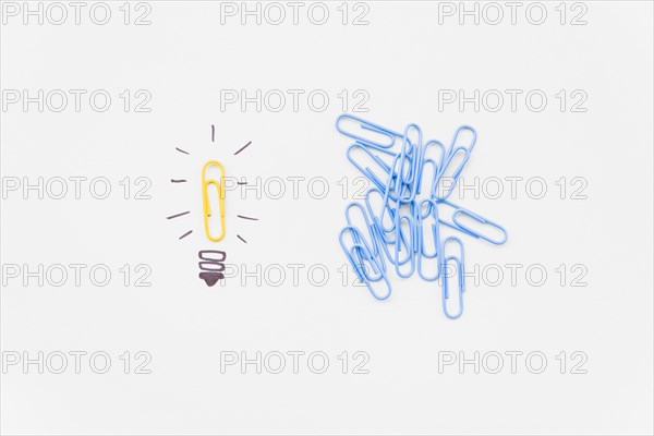 Bulb drawing with yellow paperclip as light