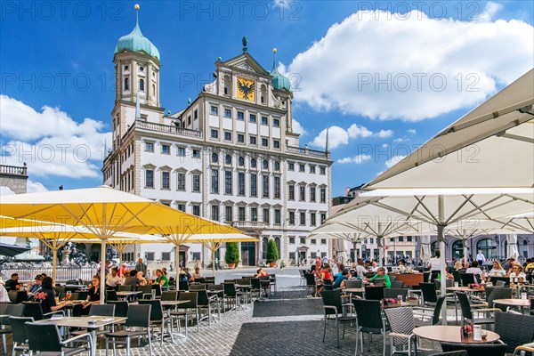 Restaurant terraces on the town hall square with town hall