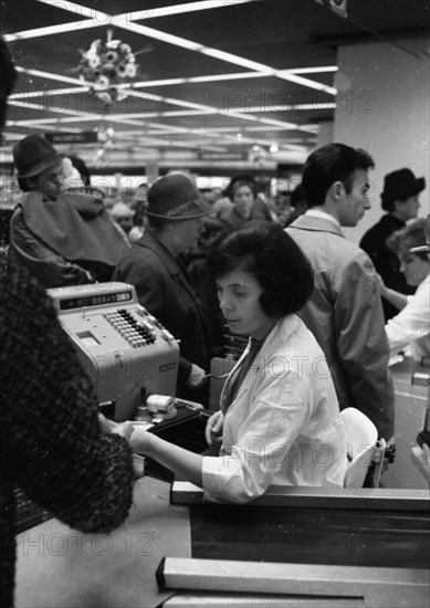 The work of a housewife and mother shopping for groceries at the supermarket and Aldi