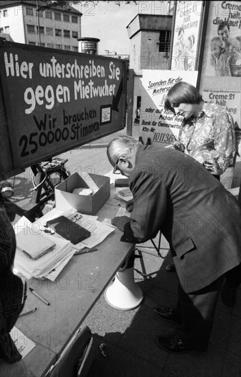 Tenants protest with a collection of signatures