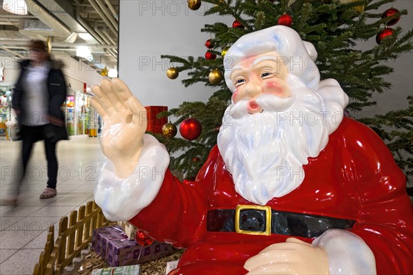 Father Christmas waving to passers-by