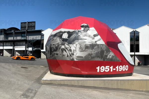 Open Air Museum Exhibition room with exhibition on racing history in the form of walk-in giant helmet with dates from decade 1951 to 1960 Fifties