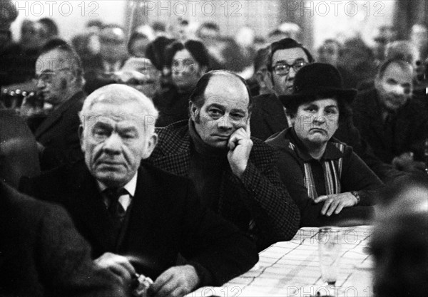 Concerned faces predominate at the tenants' protest meeting of RAG