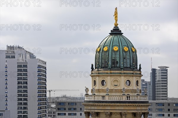 The domed tower of the German Cathedral at Gendarmenmarkt in front of newly built skyscrapers