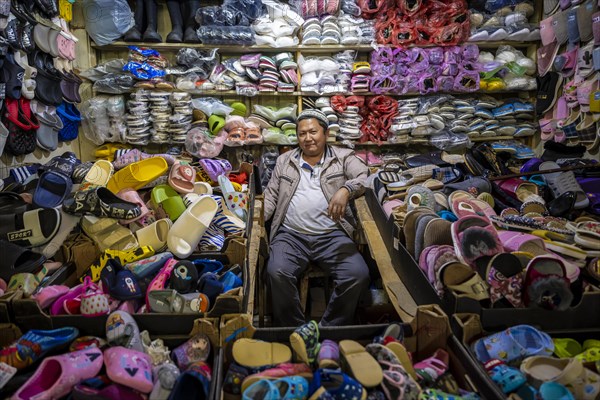Vendor of shoes in his stall