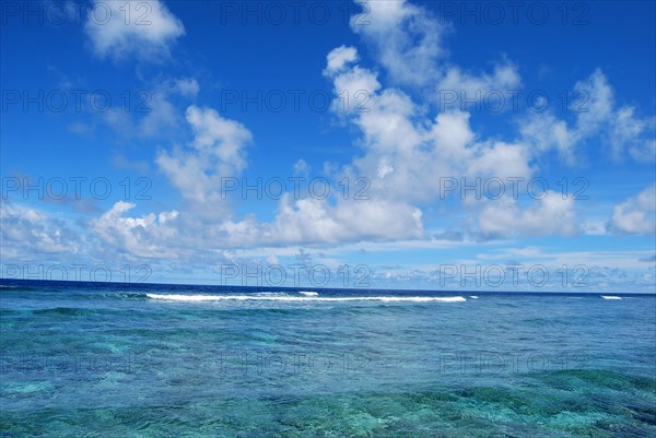 Altocumulus clouds over lagoon in Pacific Ocean