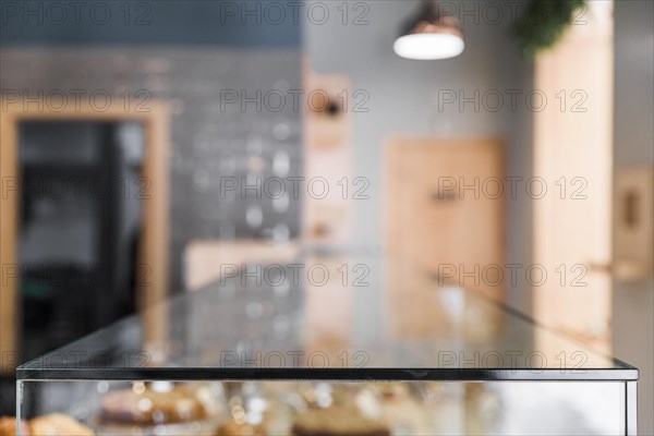 Blur backdrop coffee shop with glass counter