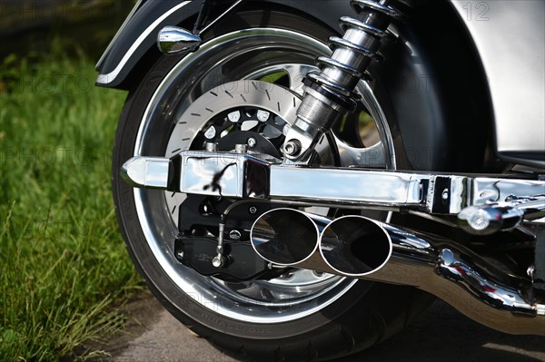 Rear wheel and exhaust of a Boss Hoss