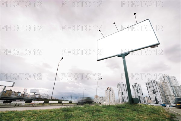 Billboard city entrance cloudy day