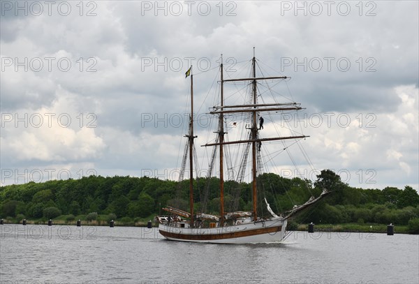 Three-master sailing through the Kiel Canal