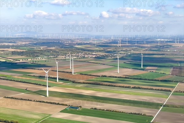 Aerial view of wind turbines on agricultural land in the background large number of wind turbines