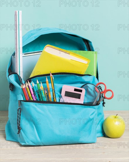 Blue school bag with essential supplies