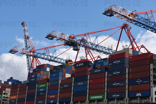 Container ship being loaded in the container port of Hamburg