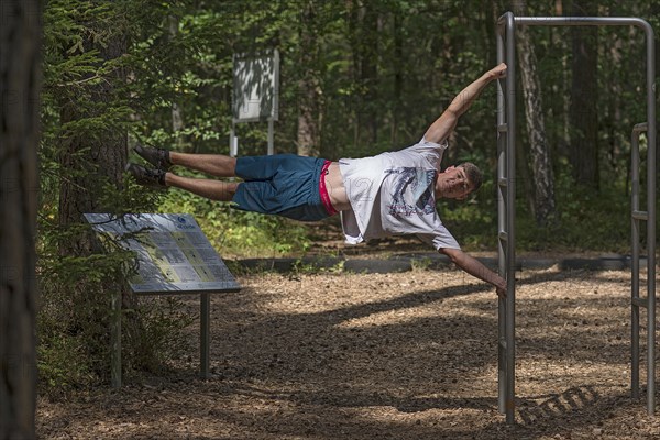 Young man on a fitness course