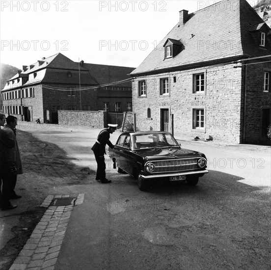 Government representatives with their vehicles in 1966 during a police check at the hitherto secret atomic bunker of the Federal Government in the Ahr valley