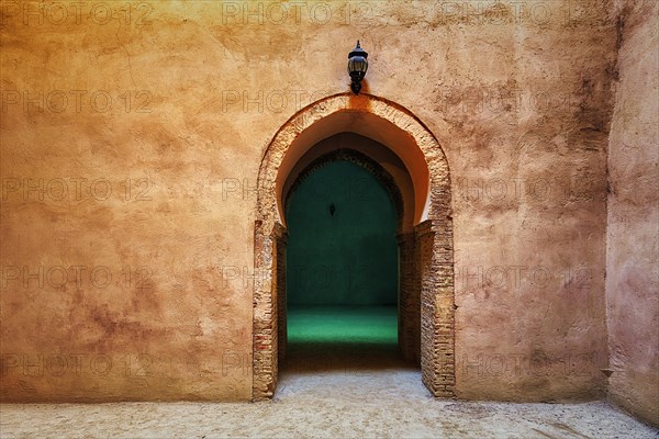 Archway in plain clay wall