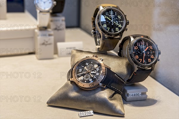 High-quality watches of the luxury brand Breguet in the shop window with price tag