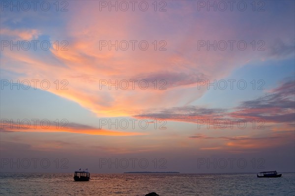 Altostratus clouds illuminated by setting sun at sunset