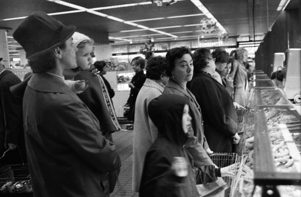 The work of a housewife and mother shopping for groceries at the supermarket and Aldi