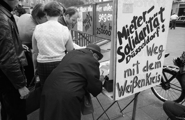 Tenants protest with a collection of signatures