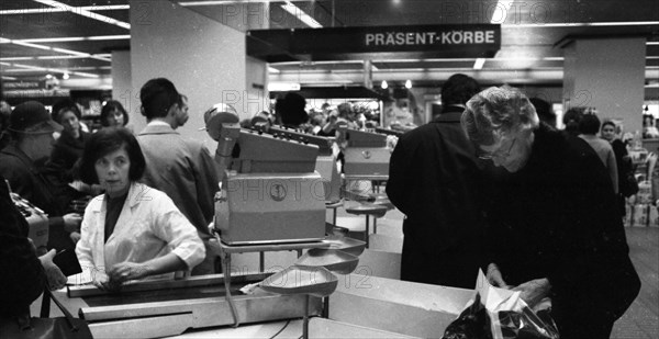 The work of a housewife and mother shopping for groceries at the supermarket and Aldi