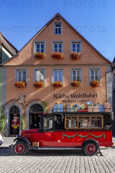 Decorated vintage bus in front of the house of Kaethe Wohlfahrt Christmas Village