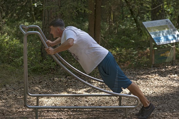 Young man on a fitness course