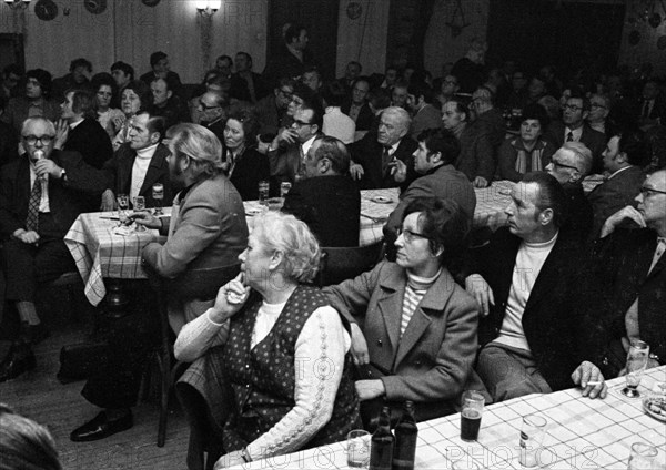 Concerned faces predominate at the tenants' protest meeting of RAG