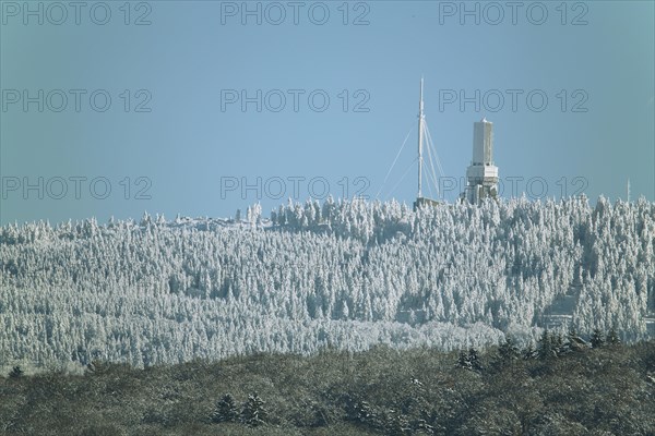 View of Grosser Feldberg with broadcasting tower in winter landscape