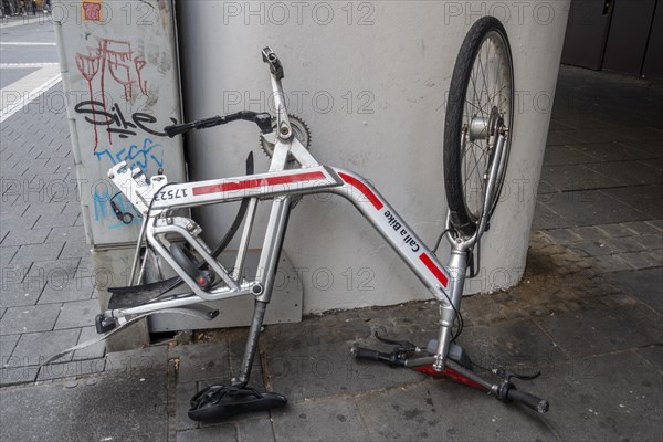 Bicycle standing on handlebars and saddle with dismounted rear wheel from Call a Bike of Deutsche Bahn