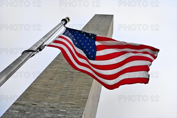 American flag in front of the Washington Monument on the National Mall