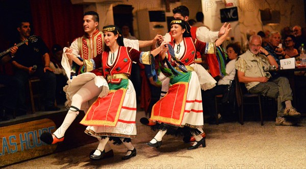 Tourists encounter impressive evidence of Roman and Greek history on a round trip through western Turkey and to the Greek island of Rhodes. The picture shows: Folk dance group in front of and with tourists on the island of Rhodes in Rhodes