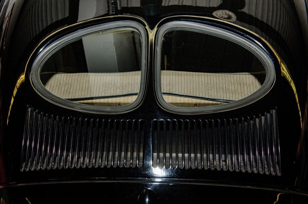 Rear section of historic Volkswagen VW Pretzel Beetle from 1938 with split rear window and 46 air vents Ventilation vents in radiator grille of bonnet