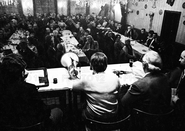 Concerned faces predominate at the tenants' protest meeting of RAG