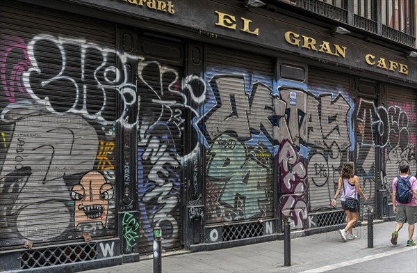 Graffiti on the blinds of vacant shops in the old town of Barcelona