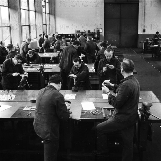 Older workers are retrained in metal trades as locksmiths and lathe operators in the Krupp AG workshops in Bochum in 1967