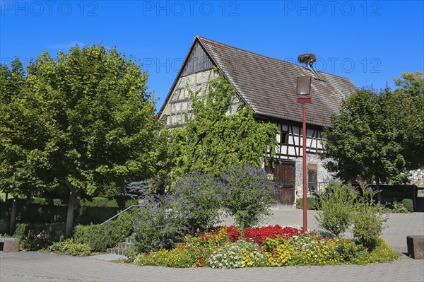 Square on the main road with flower bed