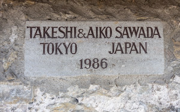 One of the numerous signs with names of donors for the reconstruction of the town wall on the covered battlements on the wall