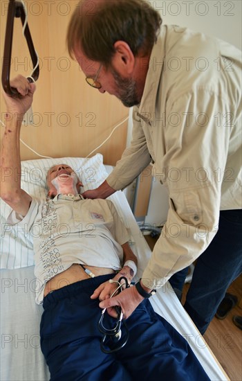 The Mother Theresa Hospice offers its guests a dignified home in a new friendly ambience for the patients in their last stage of life. This patient with carcinoma of the floor of the mouth caused by smoking and alcohol is 'allowed' to continue smoking