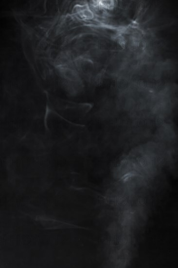 Black background with blurred smoke