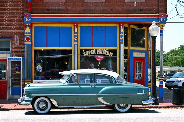 Vintage car in front of the Superman Museum in the historic district of Metropolis