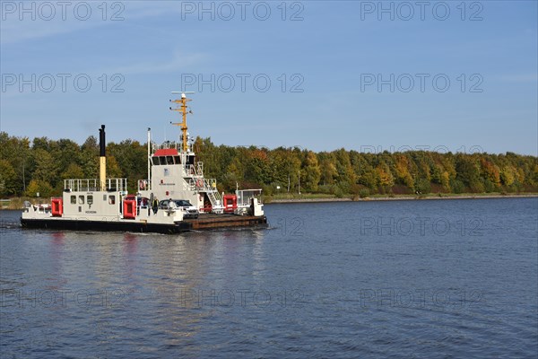 Ferry sails through the Kiel Canal in autumn