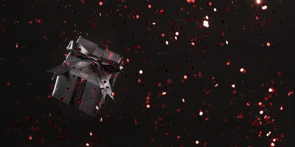 Black gift with red glitter black background