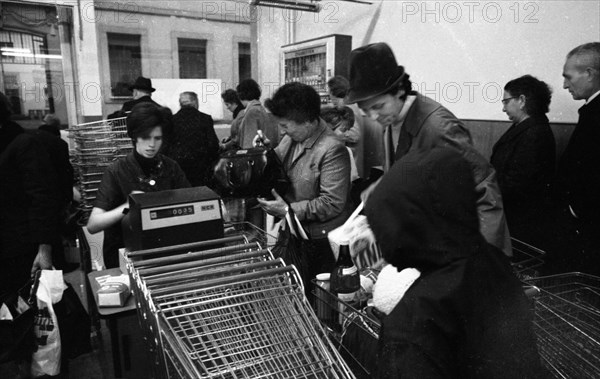 The work of a housewife and mother shopping for groceries at the supermarket and Aldi