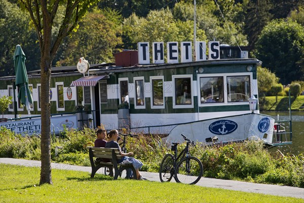 Bicycle rider at the restaurant ship Thetis