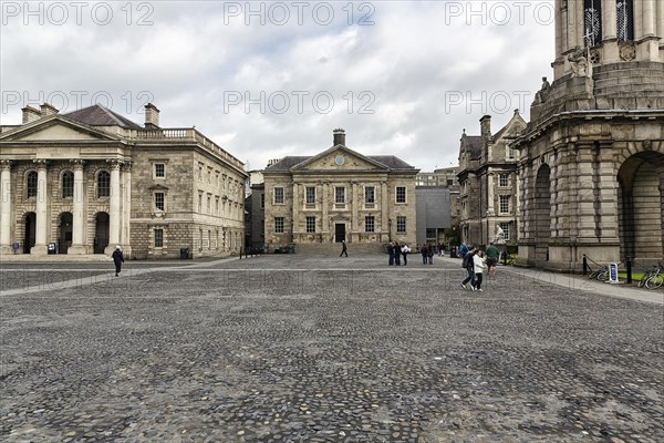 Building and pedestrians in the courtyard of the university