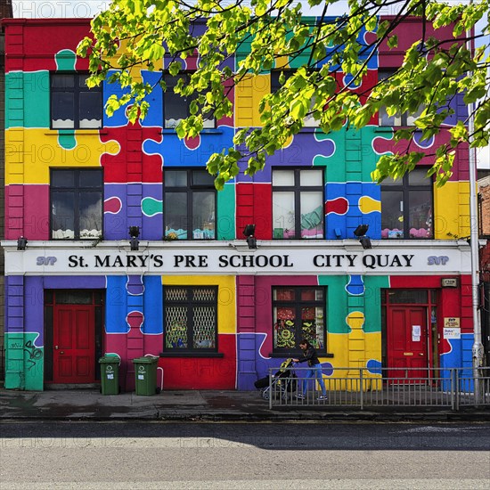 Colourful puzzle pieces on the facade of a preschool