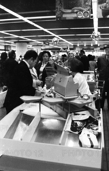 The work of a housewife and mother shopping for groceries at the supermarket and Aldi