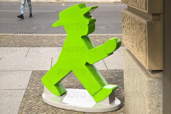 The figure of the green eastern traffic light man Galoppo by Karl Peglau in front of a souvenir shop at the Gendarmenmarkt